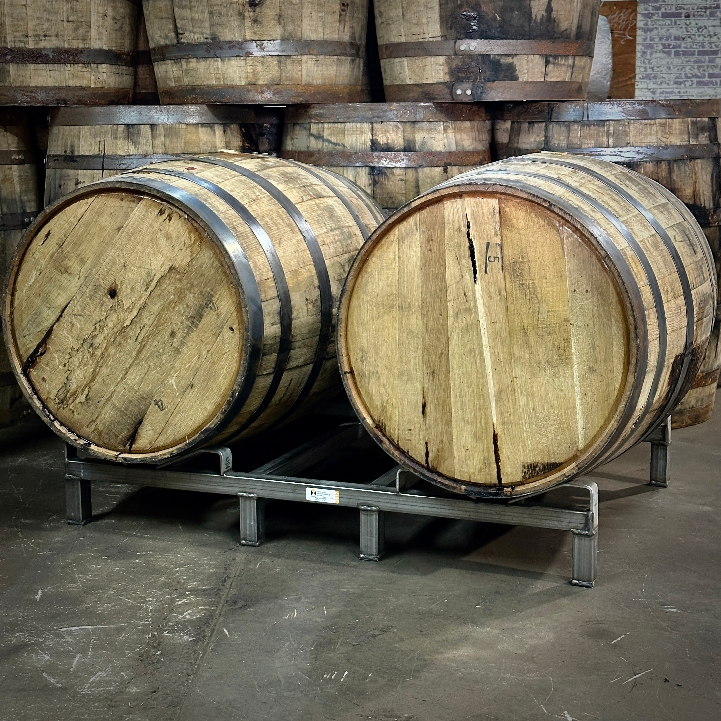 Used barrel rack with barrels on it